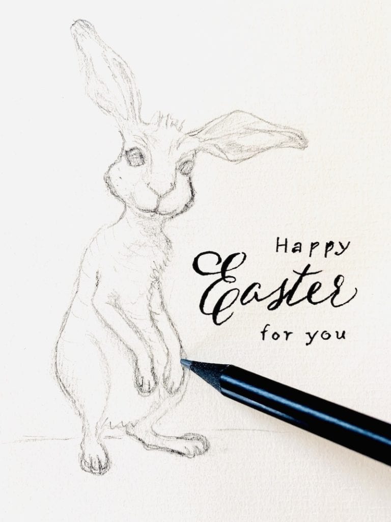 du siehst einen gezeichneten Osterhasen mit Glückwunsch zu Ostern